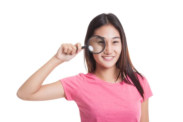 Young Asian woman with a magnifying glass — Stock Photo, Image