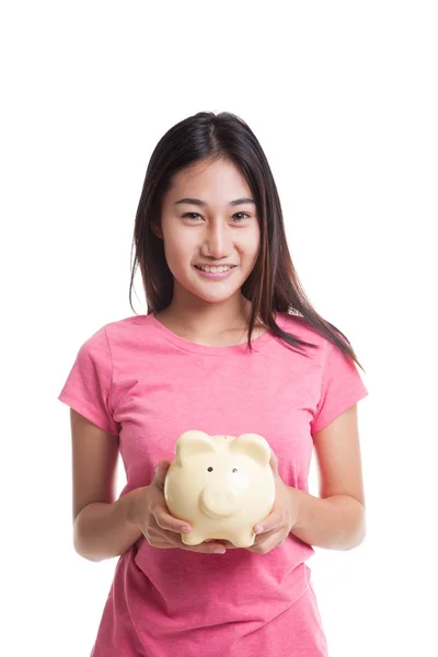 Young Asian woman with a pig coin bank — Stock Photo, Image