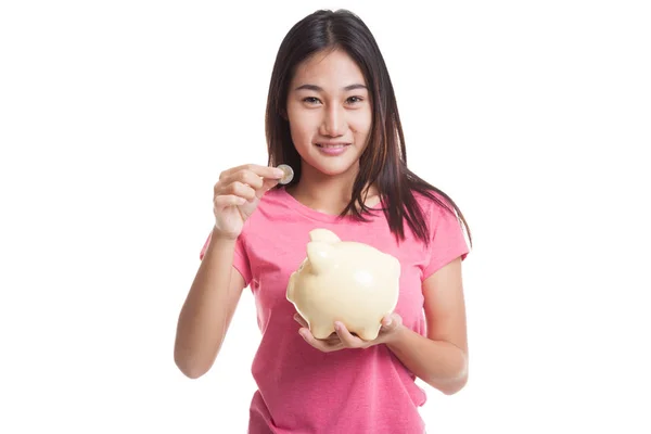 Asian woman with coin and pig coin bank. — Stock Photo, Image