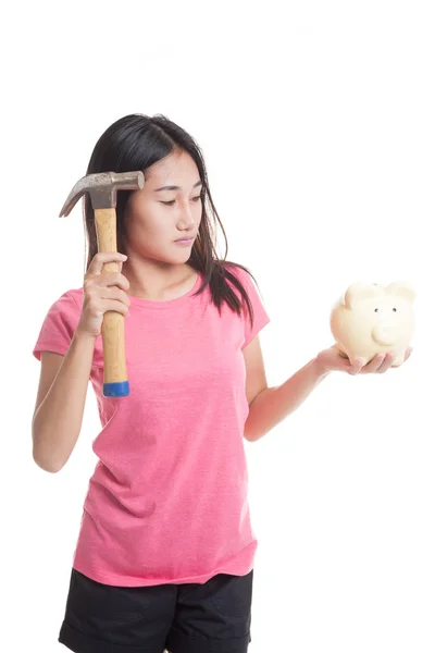 Asian woman with pig coin bank and hammer. — Stock Photo, Image