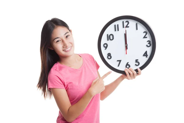 Young Asian woman point to a clock — Stock Photo, Image