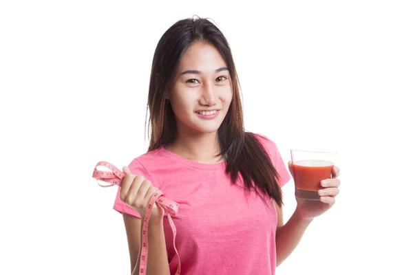 Asijské ženy s rajčatovou šťávu a měřicí pásky. — Stock fotografie