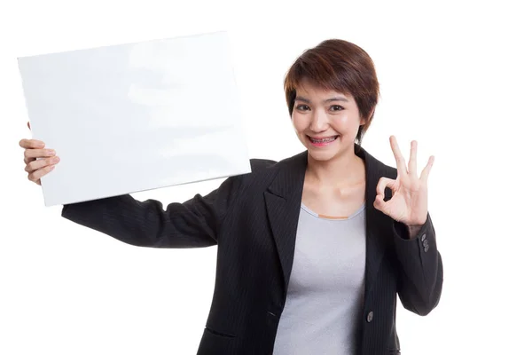 Young Asian business woman show OK with  white blank sign. — Stock Photo, Image