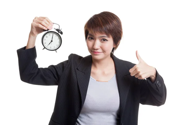 Young Asian business woman show thumbs up with a clock. — Stock Photo, Image