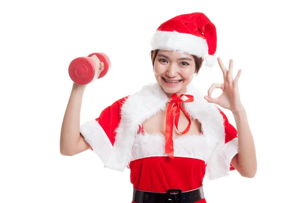 Asiático Navidad santa claus chica espectáculo ok con rojo dumbbell . — Foto de Stock