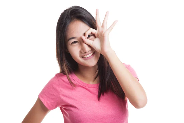 Beautiful young Asian woman show OK sign over her eye.. — Stock Photo, Image