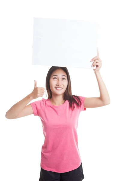 Jonge Aziatische vrouw opdagen duimen met witte leeg bord. — Stockfoto