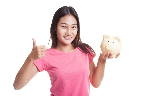 Asian woman thumbs up with pig coin bank. — Stock Photo, Image
