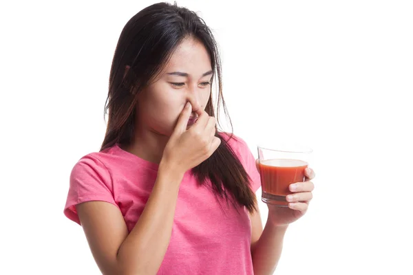 Young Asian woman hate tomato juice. — Stock Photo, Image