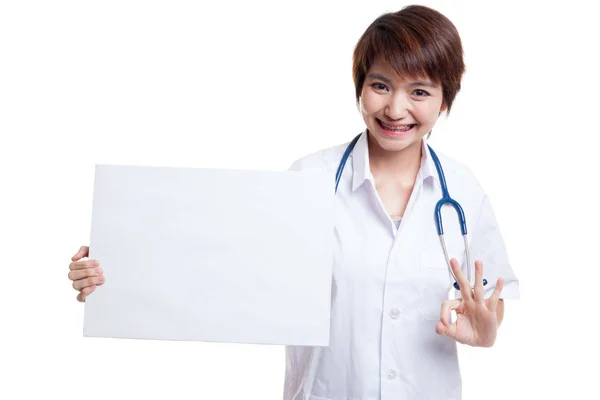 Asian female doctor show OK sign with blank sign. — Stock Photo, Image