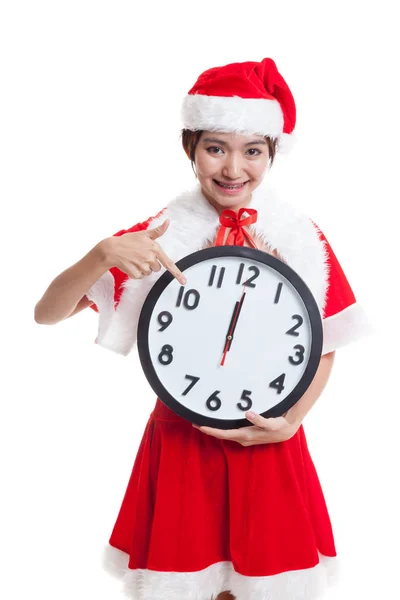 Asiatische Weihnachtsmann Mädchen zeigen auf Uhr um Mitternacht. — Stockfoto