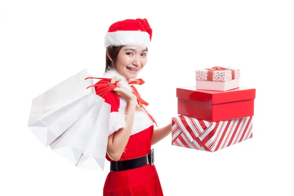 Asiatisches Weihnachtsmann-Mädchen mit Einkaufstaschen und Geschenk. — Stockfoto