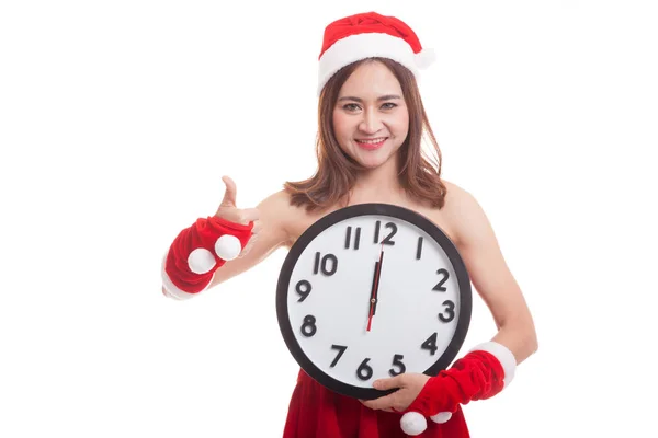 Asiatiska jul jultomten flicka tummen upp och klockan på midnigh — Stockfoto