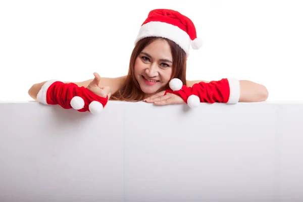 アジアのクリスマス サンタ クロース女の子親指を空白記号. — ストック写真