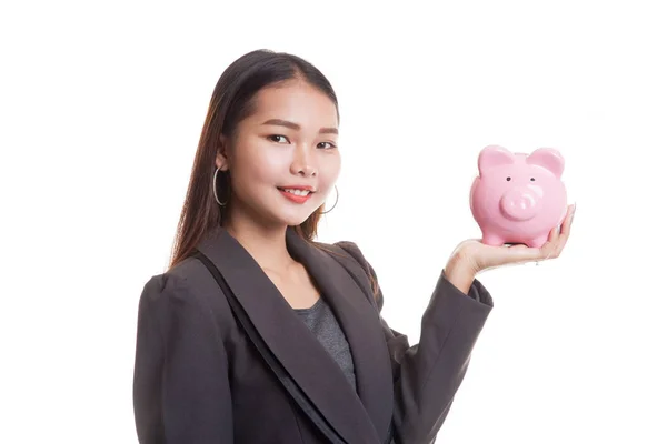 Genç Asyalı iş kadını bir domuz para banka ile. — Stok fotoğraf