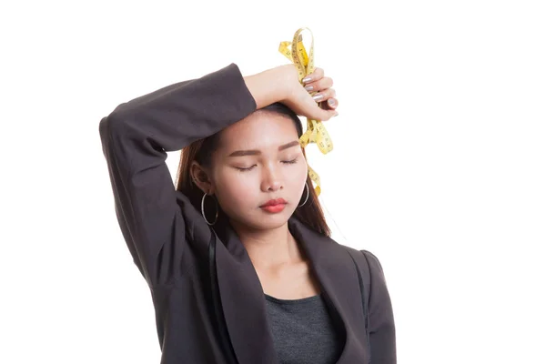 Unhappy young Asian business woman with measuring tape. — Stock Photo, Image