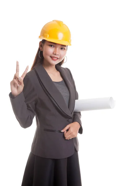 Asiatische Ingenieurin mit Bauplänen zeigt Siegeszeichen. — Stockfoto