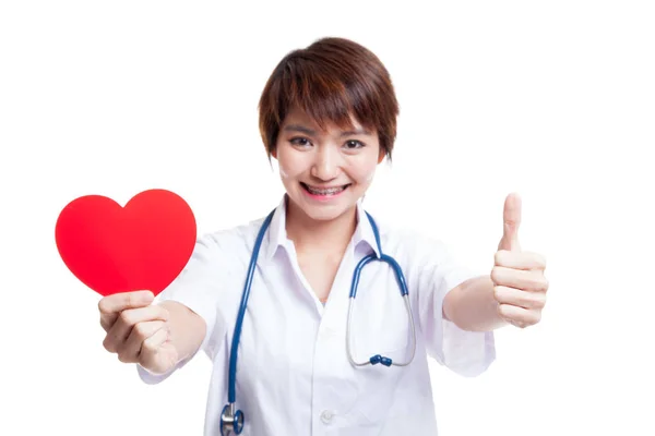 Young Asian nurse thumbs up with red heart. — Stock Photo, Image