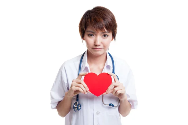 Asian young female doctor hold a red heart. — Stock Photo, Image