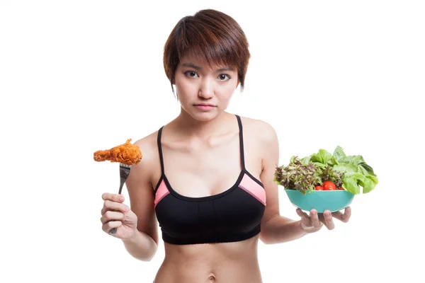 Beautiful Asian healthy girl with salad and fired chicken — Stock Photo, Image