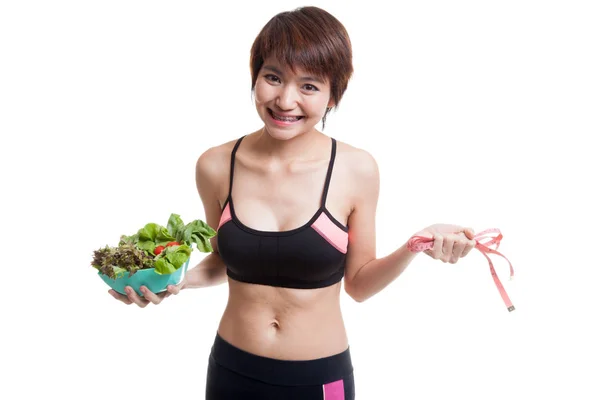 Beautiful Asian healthy girl with measuring tape and salad. — Stock Photo, Image