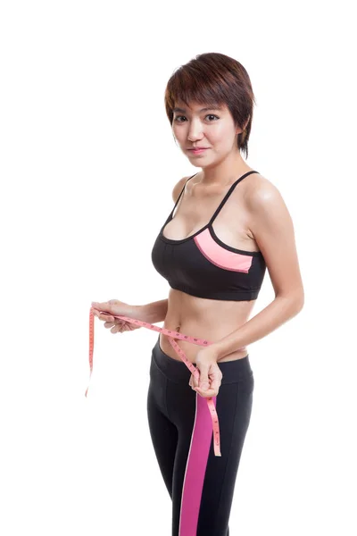 Schön asiatische gesunde Mädchen messen Ihre Taille. — Stockfoto