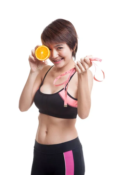 Asian healthy girl on diet with orange fruit and measuring tape. — Stock Photo, Image