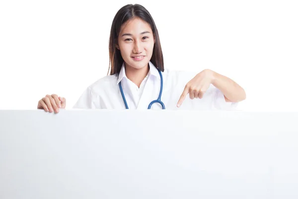 Young Asian female doctor point down to blank sign. — Stock Photo, Image