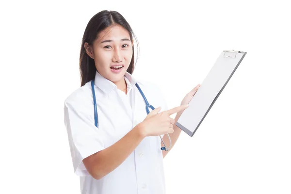 Asian young female doctor upset  point to blank clipboard. — Stock Photo, Image