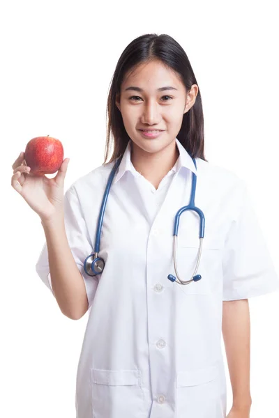 Junge asiatische weibliche Arzt zeigen einen Apfel. — Stockfoto