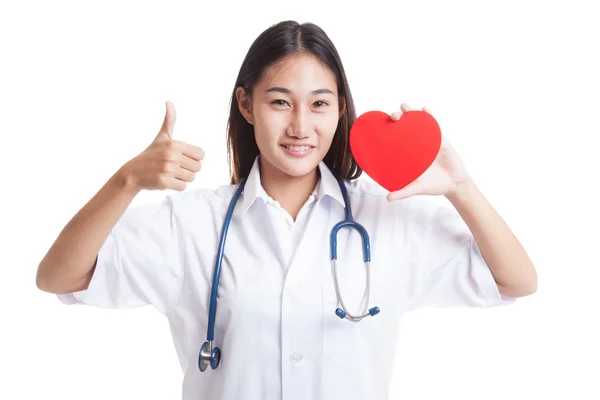 Young Asian female doctor show thumbs up with red heart. — Stock Photo, Image