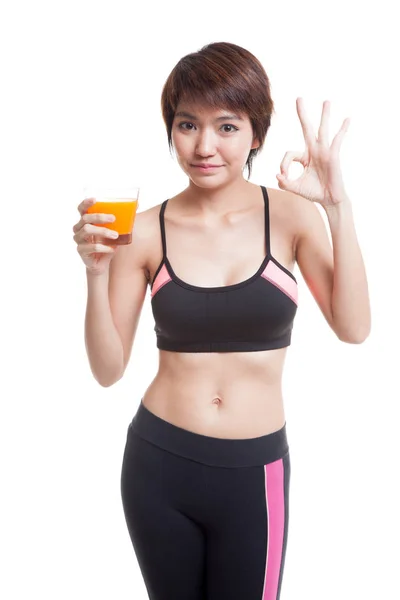 Schön asiatische gesunde Mädchen trinken Orangensaft zeigen ok Zeichen — Stockfoto