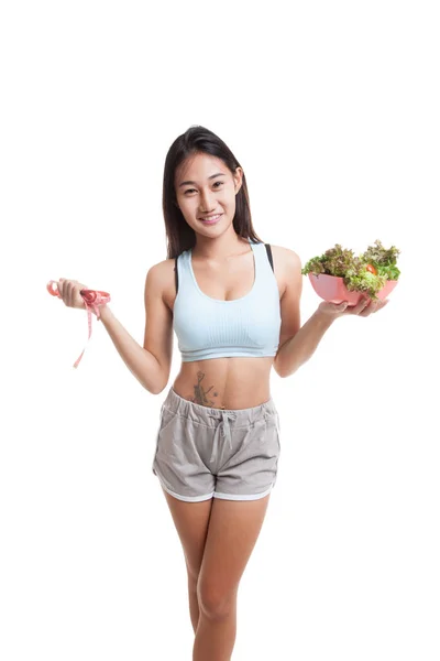 Beautiful Asian healthy girl with measuring tape and salad. — Stock Photo, Image