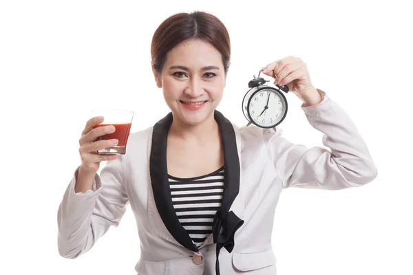 Young Asian business woman with tomato juice and clock. — Stock Photo, Image