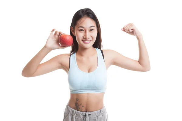 Piękny Asian girl zdrowy wyginanie biceps z czerwonym jabłkiem. — Zdjęcie stockowe