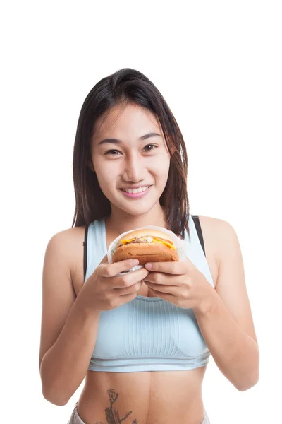 Mooie Aziatische gezond meisje geniet van eten hamburger. — Stockfoto