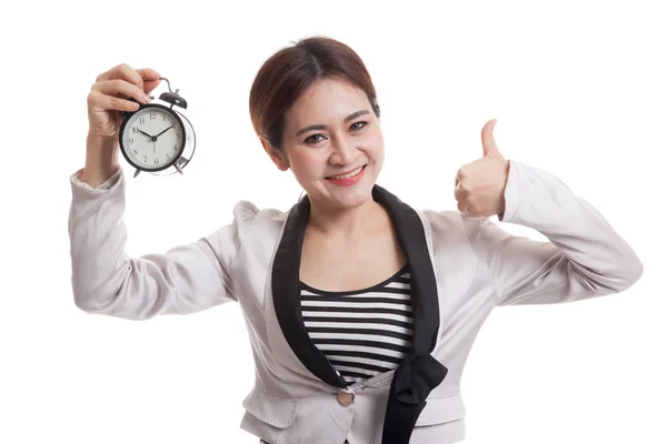 Young Asian business woman show thumbs up with a clock. — Stock Photo, Image