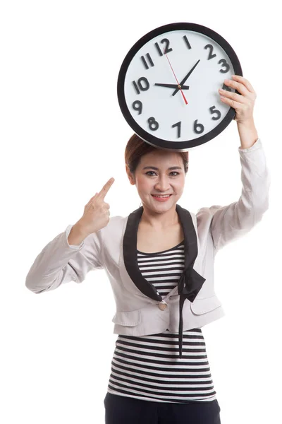 Young Asian business woman point to a clock. — Stock Photo, Image