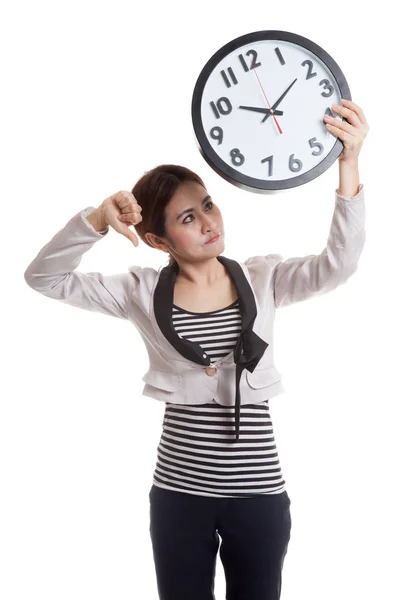 Young Asian business woman thumbs down with a clock. — Stock Photo, Image