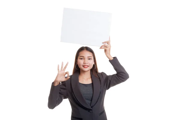 Young Asian business woman show OK with  white blank sign. Stock Image