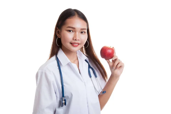 Unga asiatiska kvinnliga läkare leende visar ett äpple. — Stockfoto