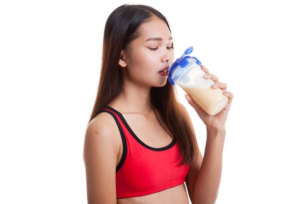 Beautiful Asian healthy girl drinking whey protein. — Stock Photo, Image