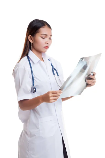 Asian young female doctor look at x-rey film — Stock Photo, Image