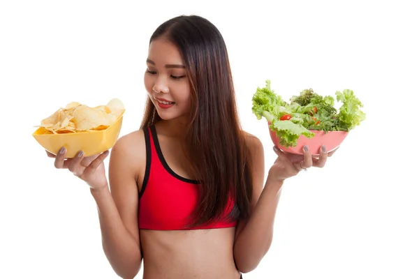 Beautiful Asian healthy girl salad and potato chips. — Stock Photo, Image