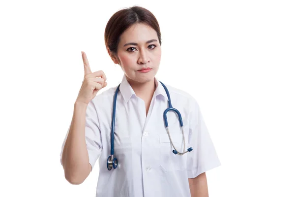 Asiatiska unga kvinnliga läkare pekar upp. — Stockfoto