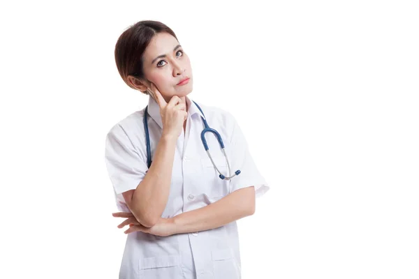 Asian young female doctor thinking looking up. — Stock Photo, Image