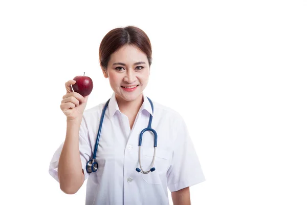 Mladé asijské ženského lékaře úsměv show apple. — Stock fotografie