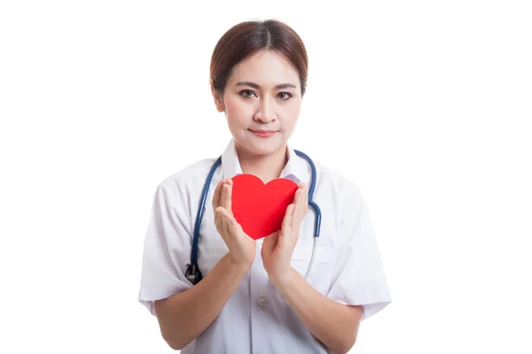 Asian young female doctor hold a red heart. — Stock Photo, Image