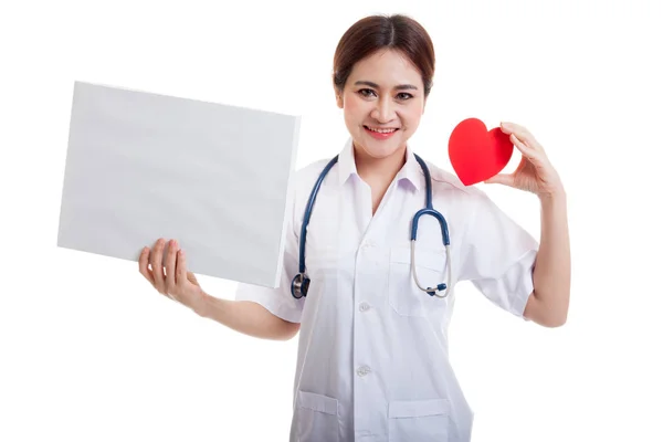 Young Asian female doctor with red heart and blank sign. — Stock Photo, Image