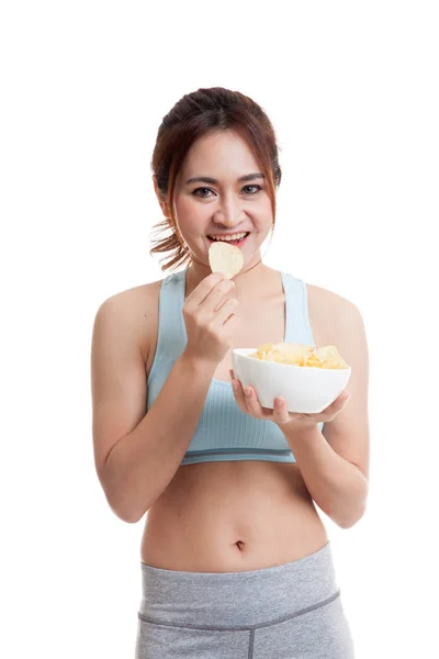 Beautiful Asian healthy girl  eat potato chips. — Stock Photo, Image